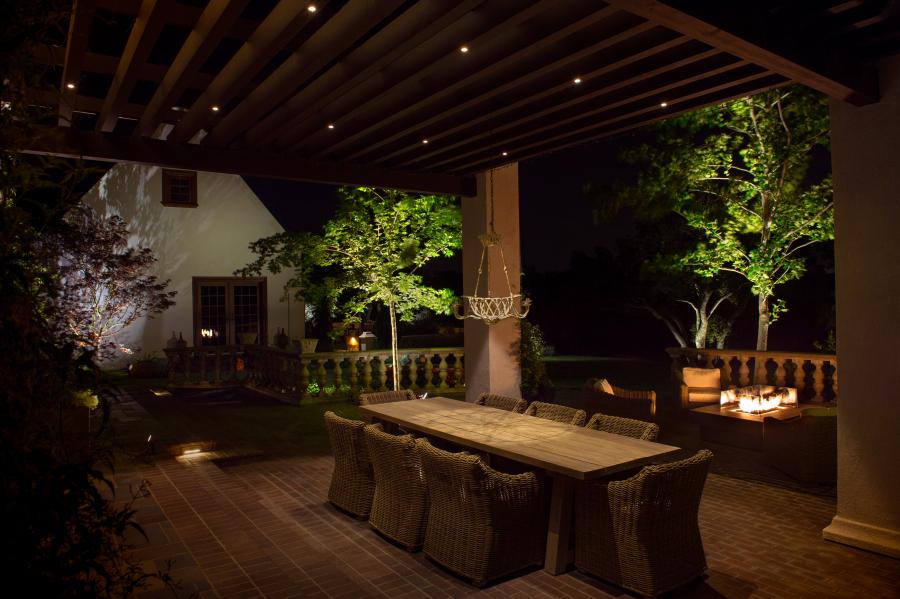 home outdoor dining deck with night lighting
